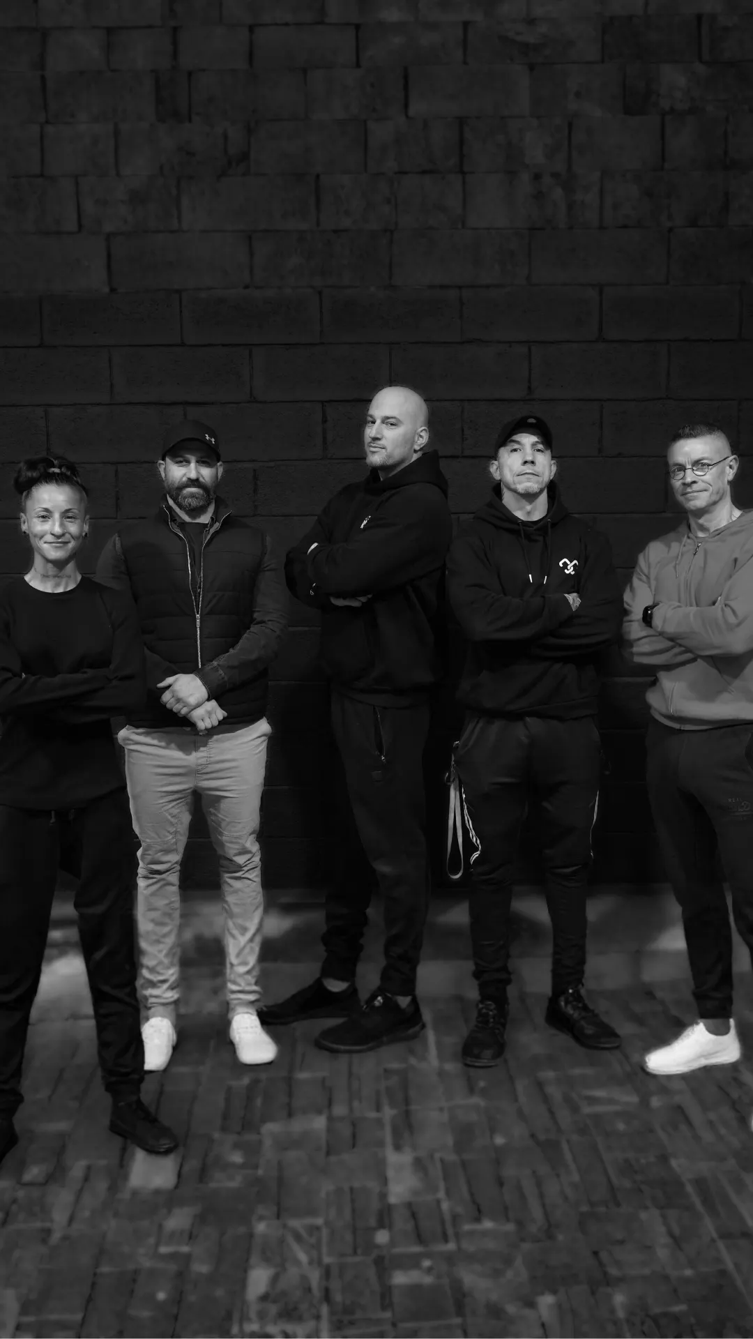 Photo de groupe de l'équipe de coachs sportifs de la salle de fitness et combat l'Héritage à Briey